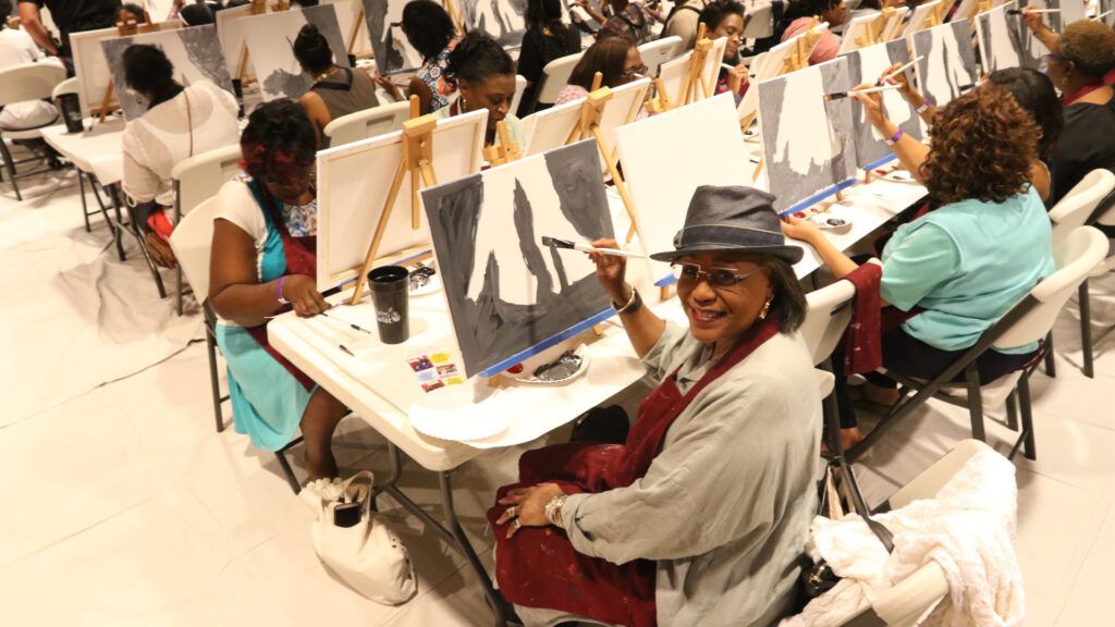 Lois Evans paints with the ladies of Oak Cliff Bible Fellowship
